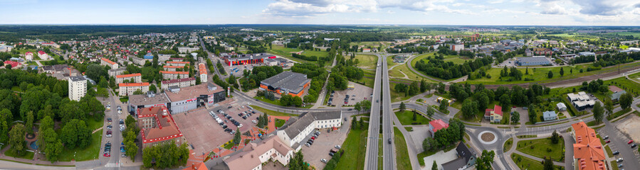 Panorama. Aerial photography. Small city landscape, amazing clouds.