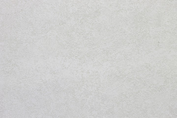 the plaster linear decoration on white and grey wall.