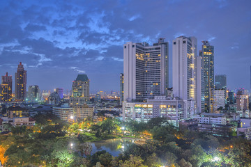 Fototapeta premium Twilight city tower building lights, cityscape downtown background