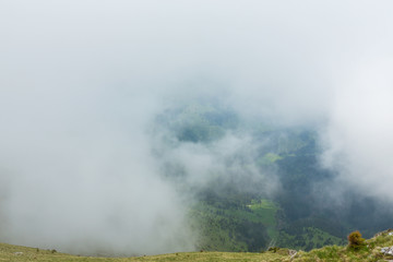 Beautiful mountain scenery with limestone rocks and storm clouds, in Piatra Craiului mountain range