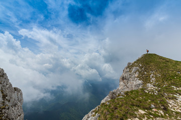 Beautiful mountain scenery with limestone rocks and storm clouds, in Piatra Craiului mountain range