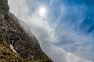 Beautiful mountain scenery with limestone rocks and storm clouds, in Piatra Craiului mountain range