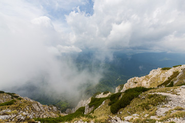 Beautiful mountain scenery with limestone rocks and storm clouds, in Piatra Craiului mountain range