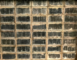 Vintage old concrete block wall, backdrop background texture closeup detail pattern
