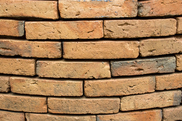 The background of the ancient brick wall is not very close together.
