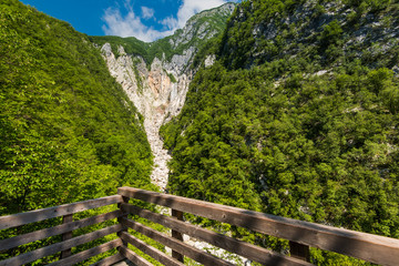 Fototapeta premium Wooden deck overlooking Boka waterfall in Slovenia