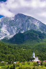 Fototapeta na wymiar Dreznica church under Julian Alps in Triglav Park, Slovenia