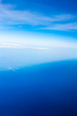 Clear blue sky. Aerial shot from the airplane window. Aircraft point of view.