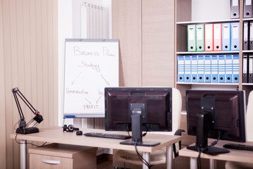 Empty office room with computers and desks. Modern interior design