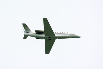 Fototapeta na wymiar Travel background with airplane flying in the blue sky