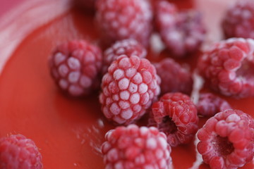 Frozen berry raspberry with white hoarfrost