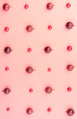 Mix of berries isolated over pink background table.