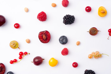 Mix of berries isolated over white background table.