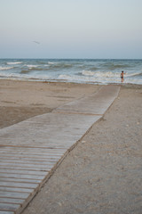 Wooden walkway to the sea