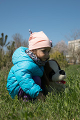 Girl with a toy dog