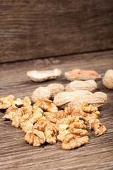 Walnuts on wooden background in studio photo