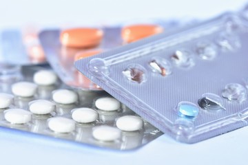 Drugs or vitamins in tablets. Packaging blister. Isolated on a white background.