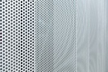 Gray metal background, round perforated metal texture
