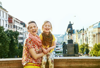 Naklejka premium happy mother and daughter tourists in Prague Czech Republic