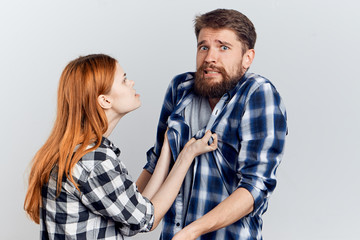 Young guy with beard and beautiful woman on white isolated background, repair, housework