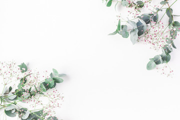Flowers composition. Frame made of of pink gypsophila flowers and eucalyptus branches on white background. Flat lay, top view, copy space - 164542965