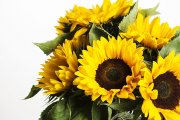 Bright sunflowers bouquet on white background, close up