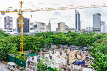 Construction tower crane and worker in jobsite. The workplace in center of city.