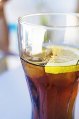 glass of cola with lemon drink