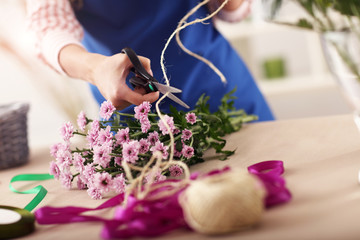 Female florist working in flower shop