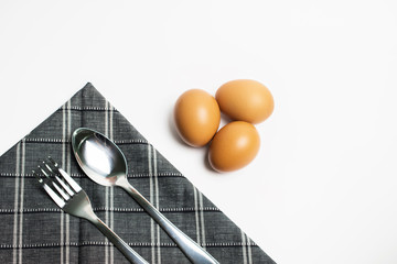 eggs with spoon on white background.