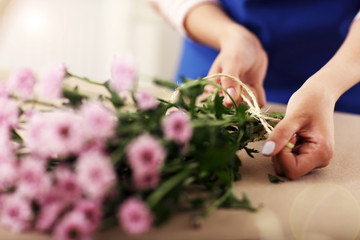 Female florist working in flower shop