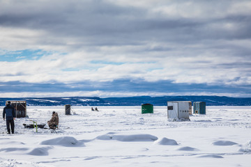 Ice Smelt Fishing Shack during a Cold but Sunny Day of Winter in Quebec