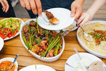 Friends Happiness Enjoying Dinning Eating Concept. Food Buffet. Catering Dining. Eating Party. Sharing Concept