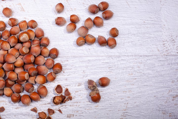 Hazelnuts on wooden background. Over top view