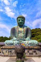 The Great Buddha in Kamakura Japan.There are pigeon to Buddha's head. Located in Kamakura, Kanagawa Prefecture Japan.