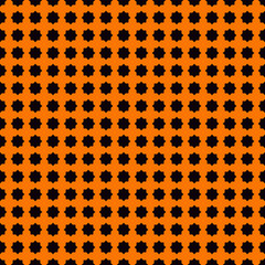 Seamless pattern with stylezed black ink spots on orange background. Halloween design concept digital paper.
