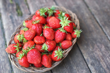Strawberry on rustic wooden background