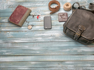 Travel Clothing man’s accessories apparel along on wooden floor