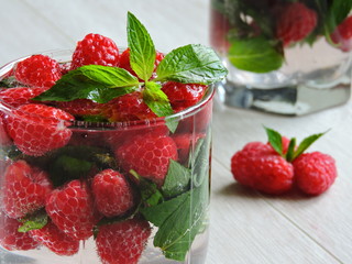 Cool drink in the heat. Bright mint drink with raspberries.