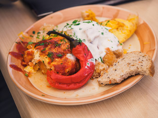 Big breakfast in cafe with arms