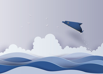 Origami made dolphin in the sea.The illustrations do the same paper art and craft style © kengmerry