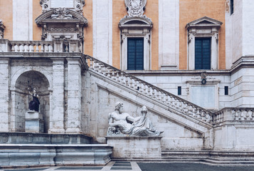 Fototapeta premium Front view of the Palazzo Senatorio (Senatorial Palace) and Fontana della Dea Roma in The Piazza del Campidoglio on top of the Capitoline Hill in Rome, Italy