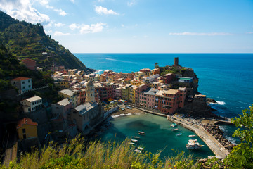 view of famous travel landmark destination Vernazza, small mediterranean old sea town with harbour coast and castle,Cinque terre National Park, Liguria, Italy. Summer sunny morning