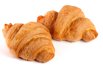 two croissant isolated on white background closeup