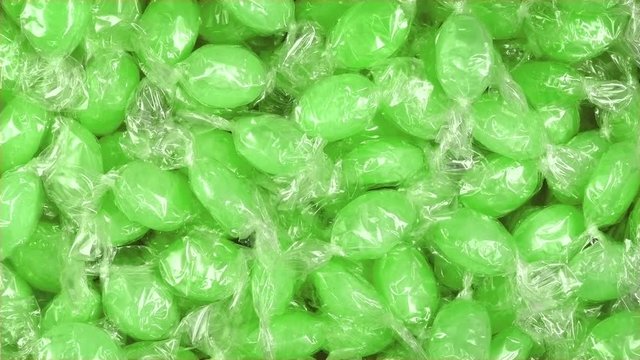 Green Candy In Wrappers Rotating
