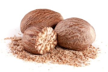 Three nutmeg and powder isolated on white background