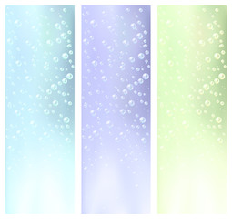 Three different colored banners with water bubbles.