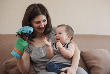 Happy little baby boy clapping his hands