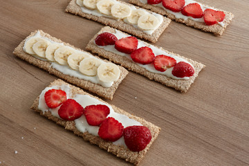 Fruit dessert. Fruits sliced on bread (cookies). View from above. Baban, strawberry. Healthy food.
