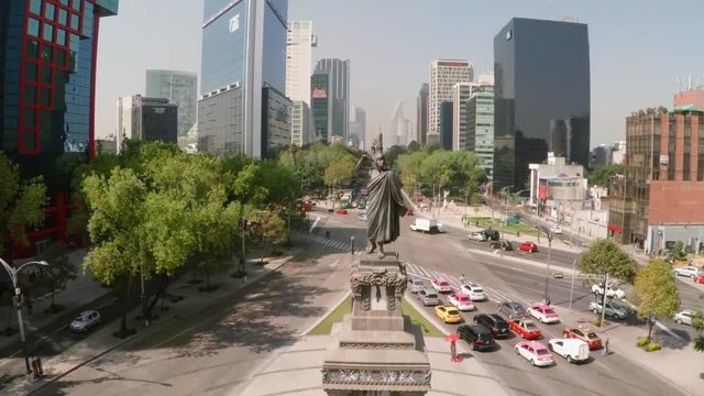Aerial glides up theCuauhtemoc   statue on the Paseo de la Reforma in Mexico City.